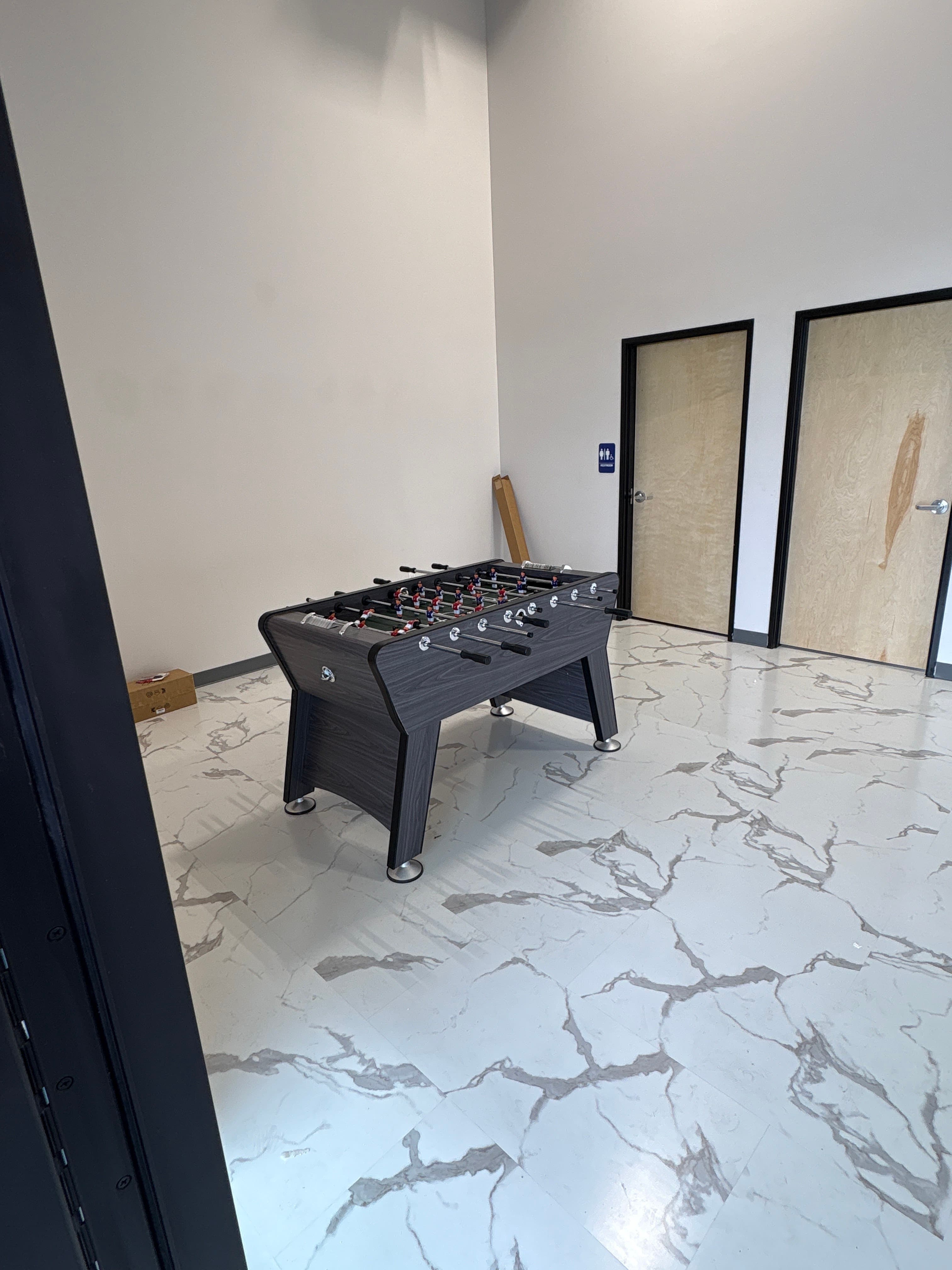 Foosball table in the waiting lounge at Clean Culture Barbershop #2